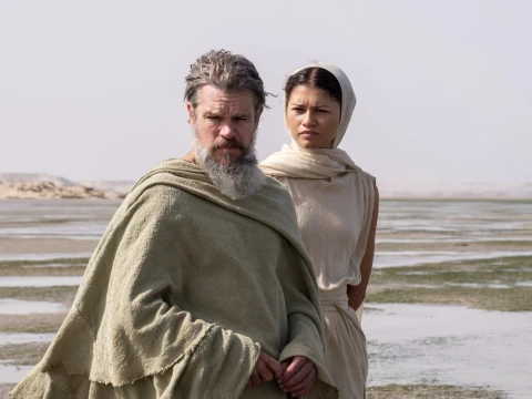 L to R: Matt Damon is Odysseus and Zendaya is Athena in THE ODYSSEY, written, produced, and directed by Christopher Nolan.